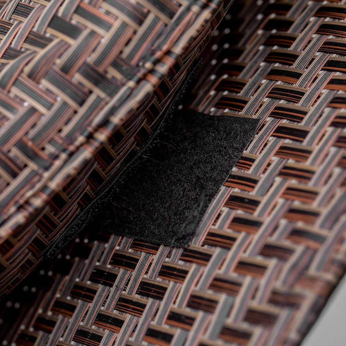 Brown woven textilene-style fabric seat pad with breathable texture on zero gravity chair