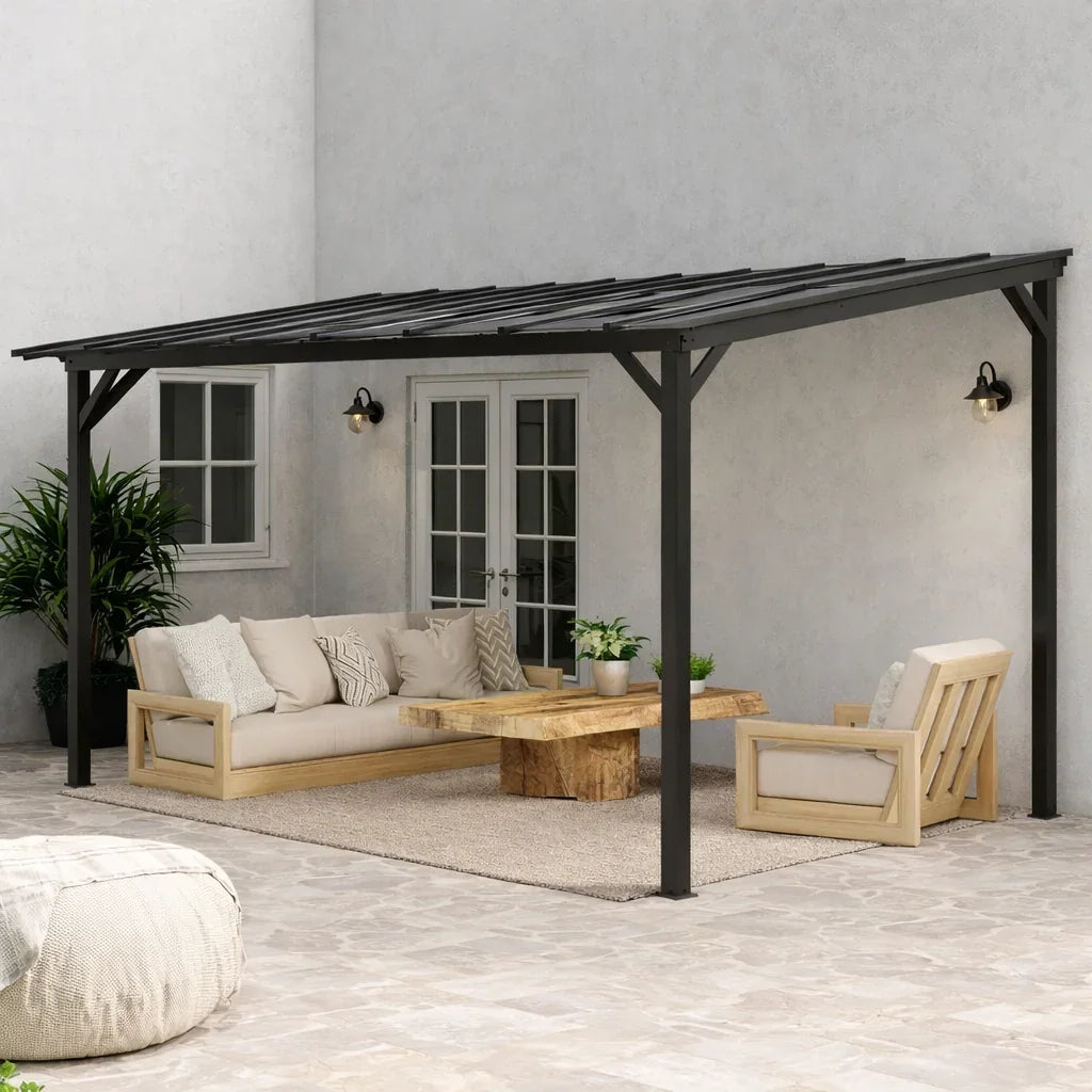 Dark grey metal wall-mounted pergola with clear polycarbonate roof over patio seating