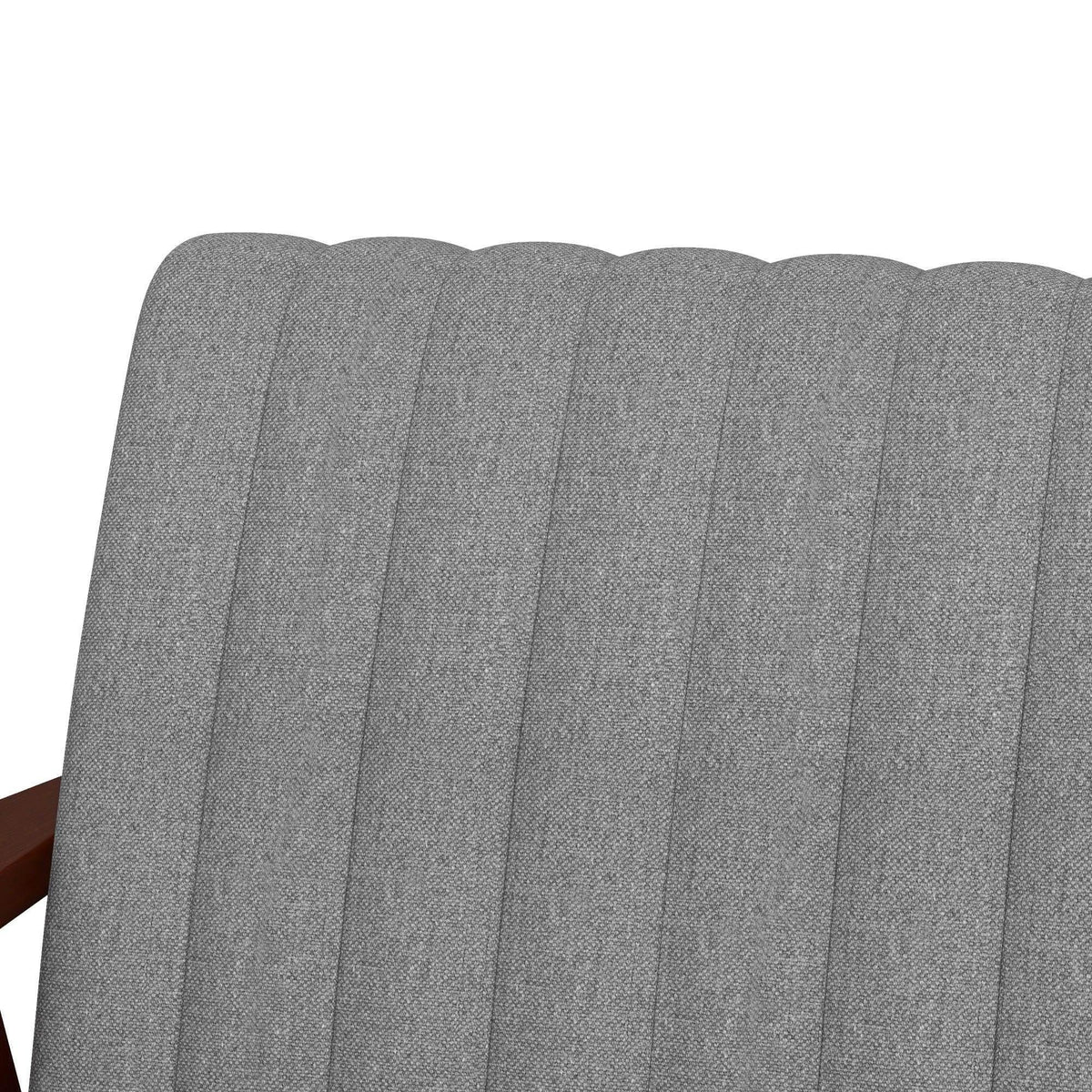 Close-up of grey tufted backrest on upholstered accent armchair