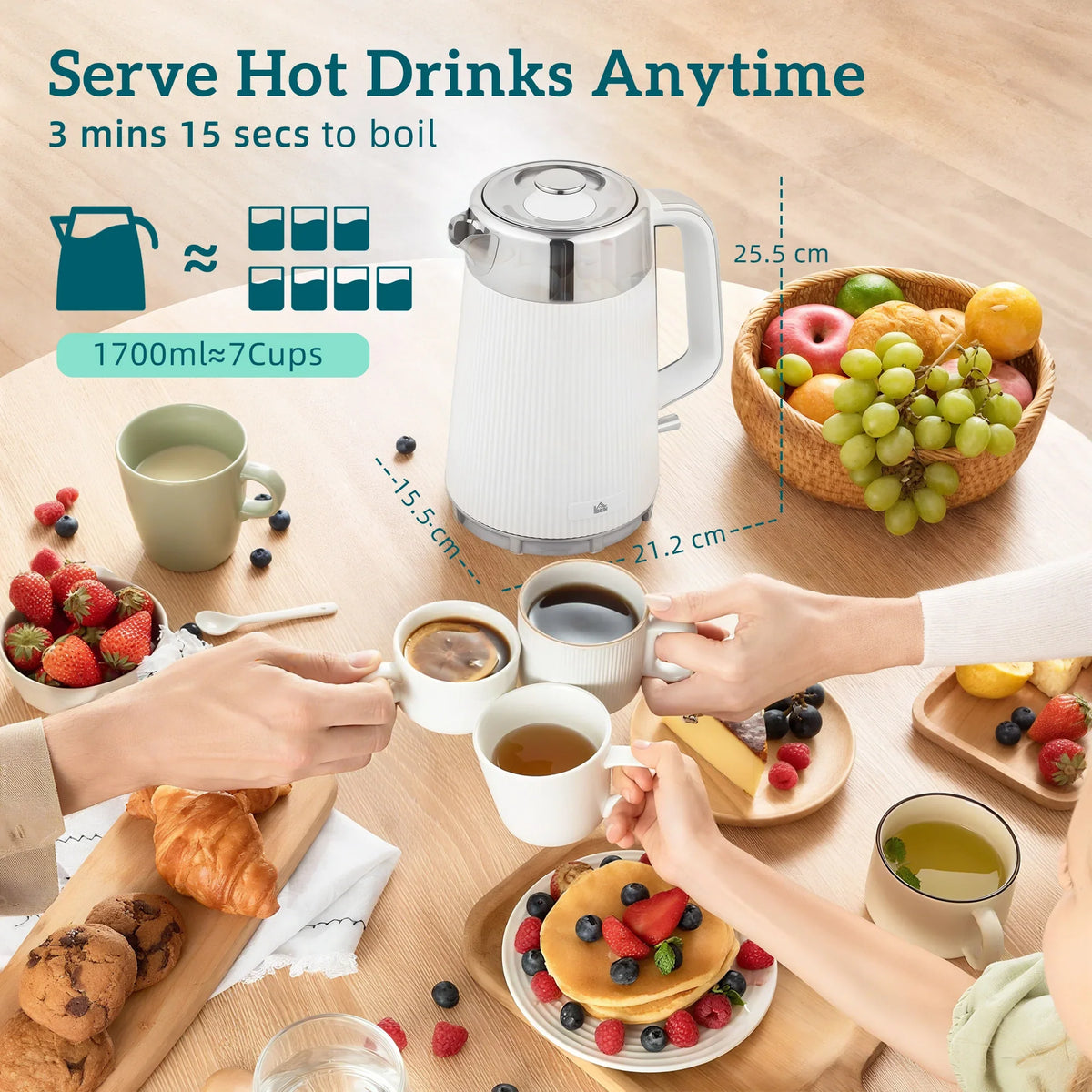 White 1.7L electric kettle on tabletop beside cups and pastries