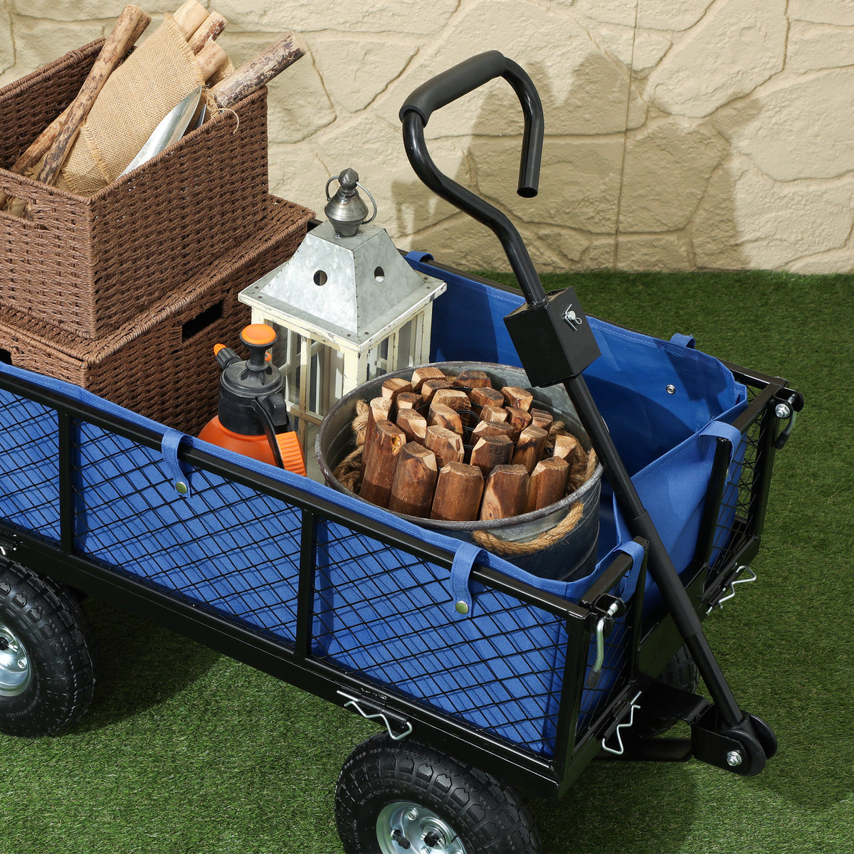 Steel garden cart with blue waterproof bag holding firewood, black frame and four wheels