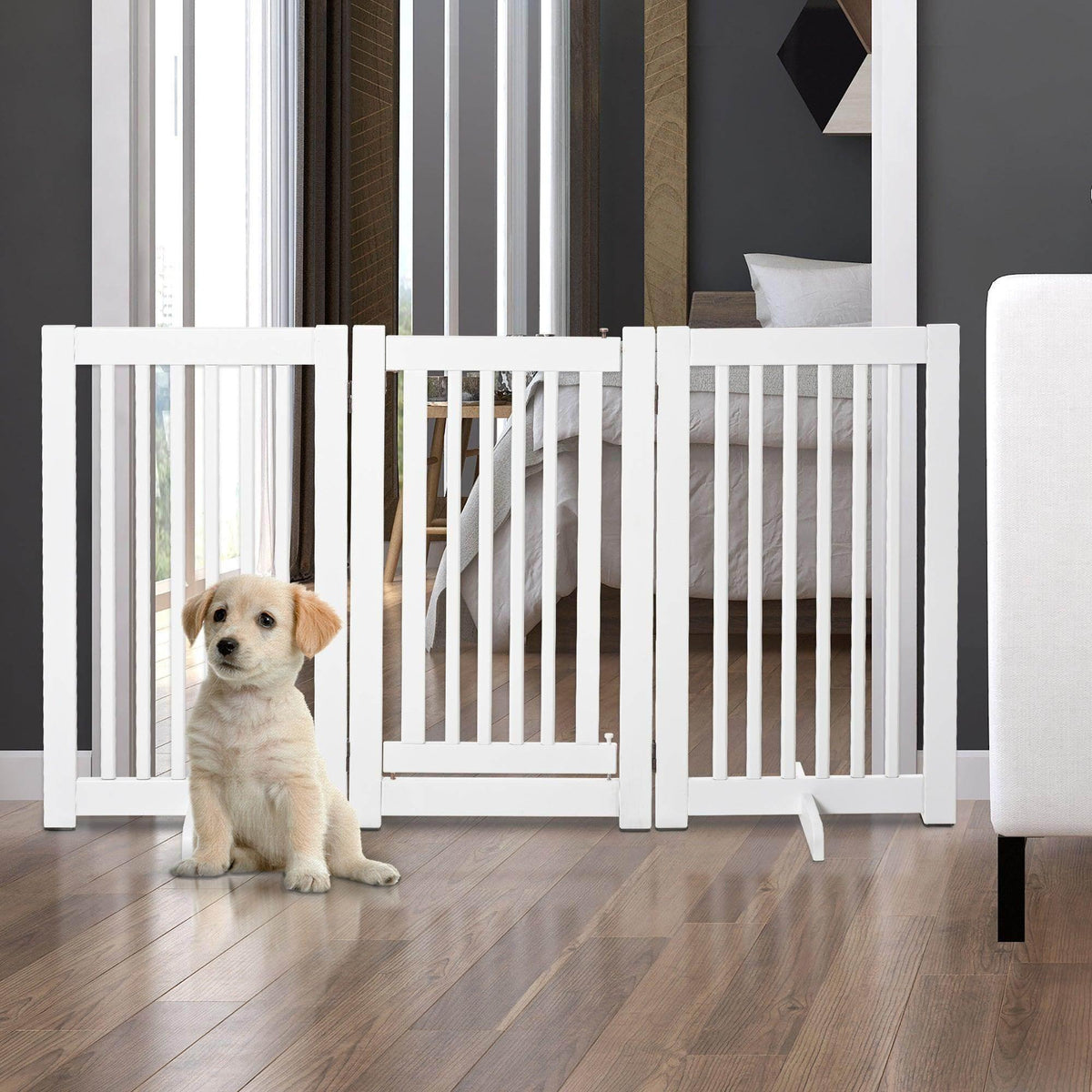 White freestanding pet barrier fence with vertical slats and hinged panels