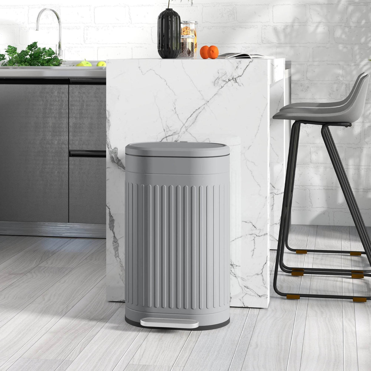 Grey pedal trash can with soft-close lid and removable inner bucket, standing upright