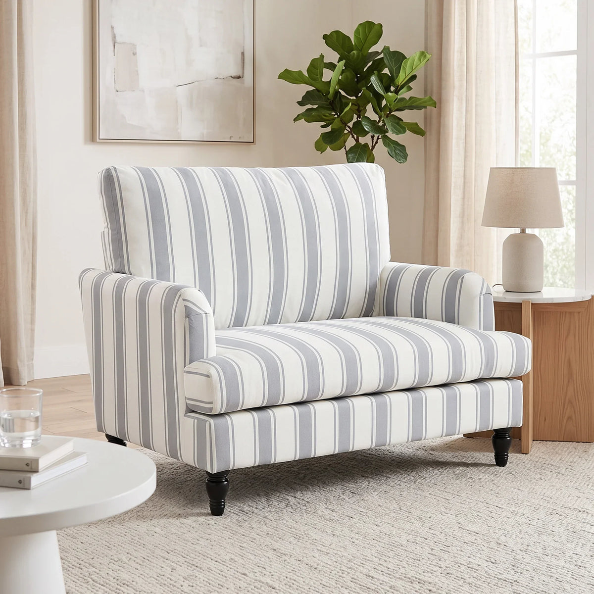Grey striped velvet armchair with wide seat and dark turned legs