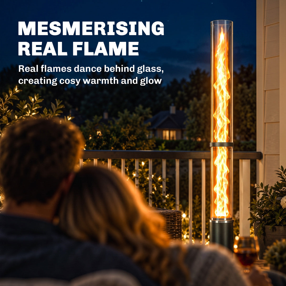 Black pellet patio heater with tall glass flame tube outdoors on a balcony