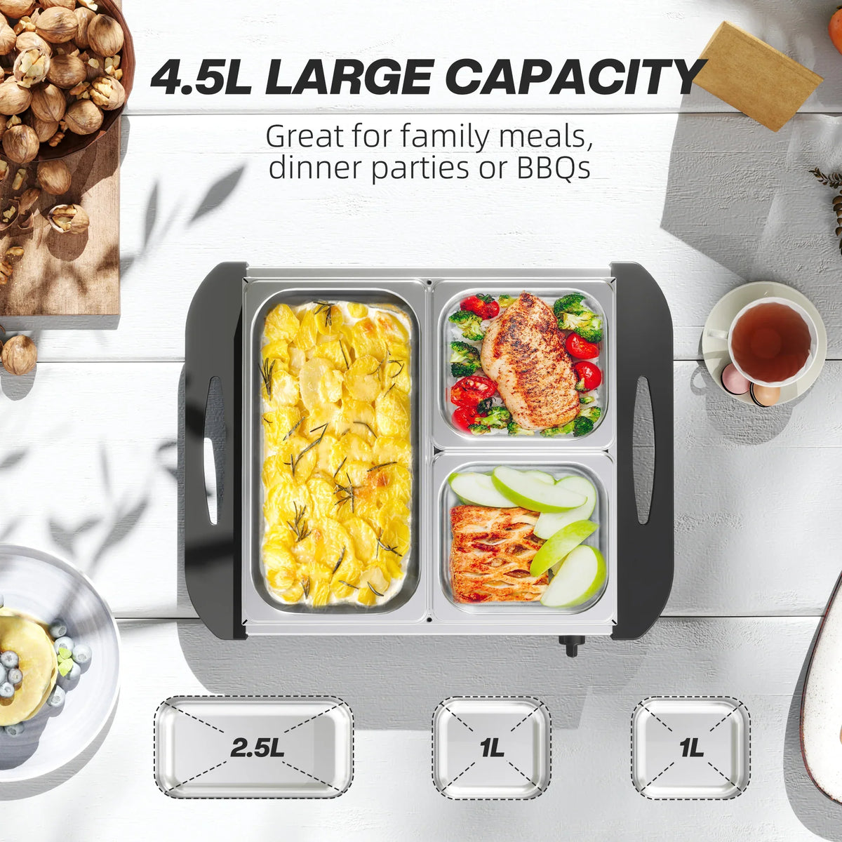 Electric buffet server with four heated stainless trays holding hot dishes