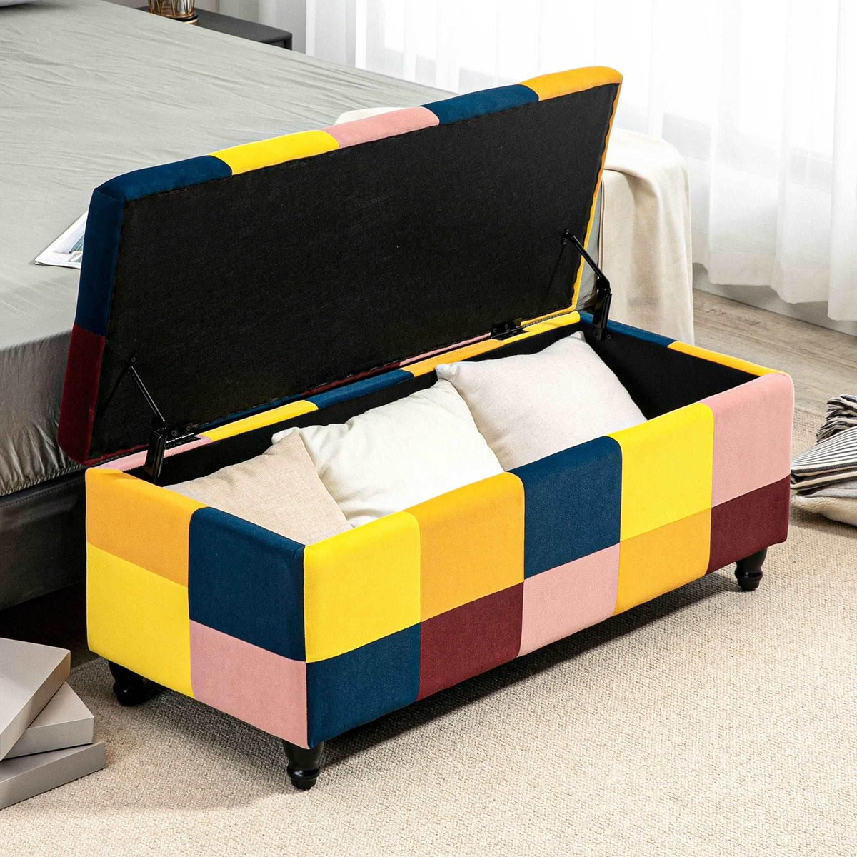 Patchwork velvet storage ottoman with hinged lid open, dark lining and storage compartment