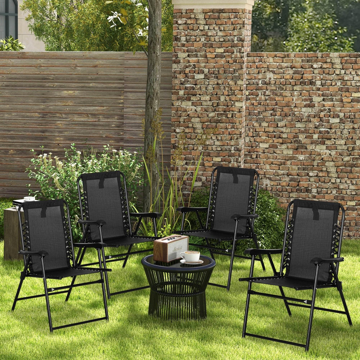 Set of 4 black folding patio chairs with armrests, mesh backs, and steel legs