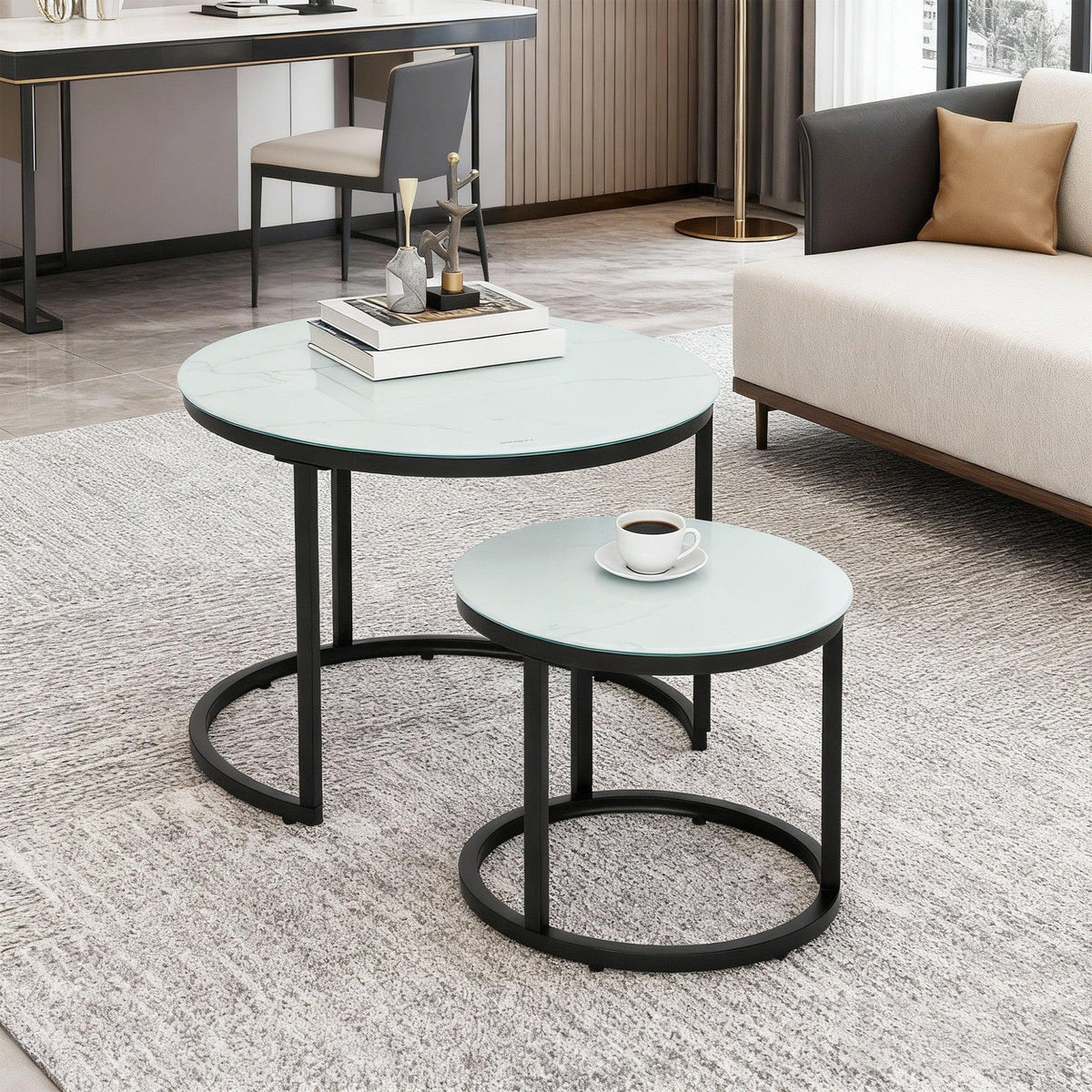 Round coffee table set of 2 with light marble-effect glass tops and matte black steel frames