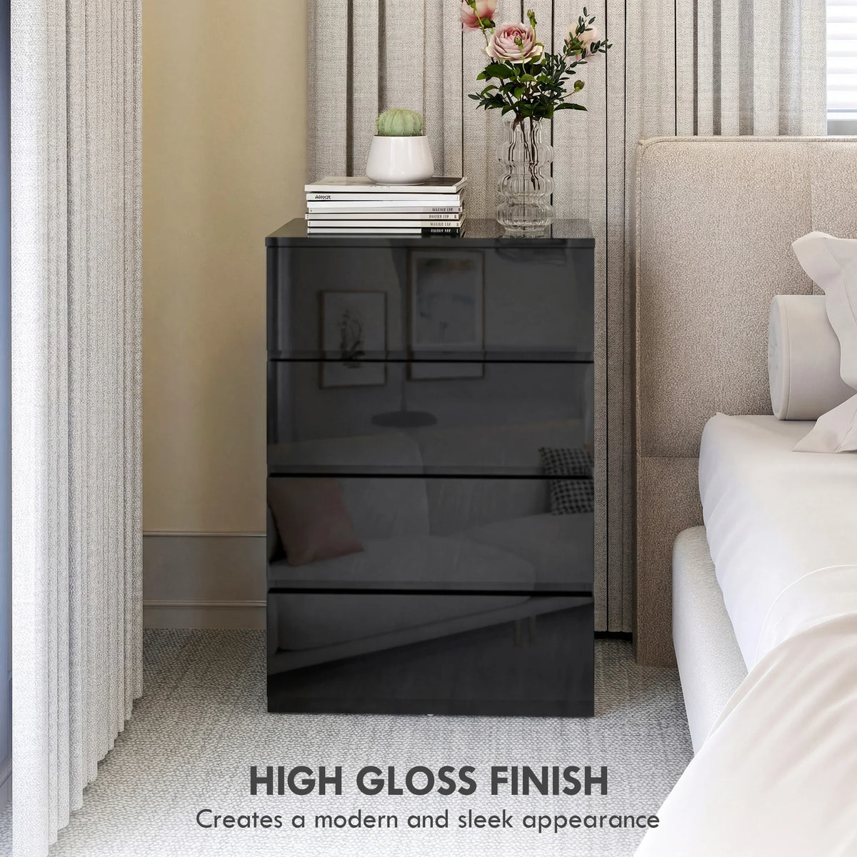 Black high-gloss 4-drawer chest standing beside bed with smooth drawer fronts