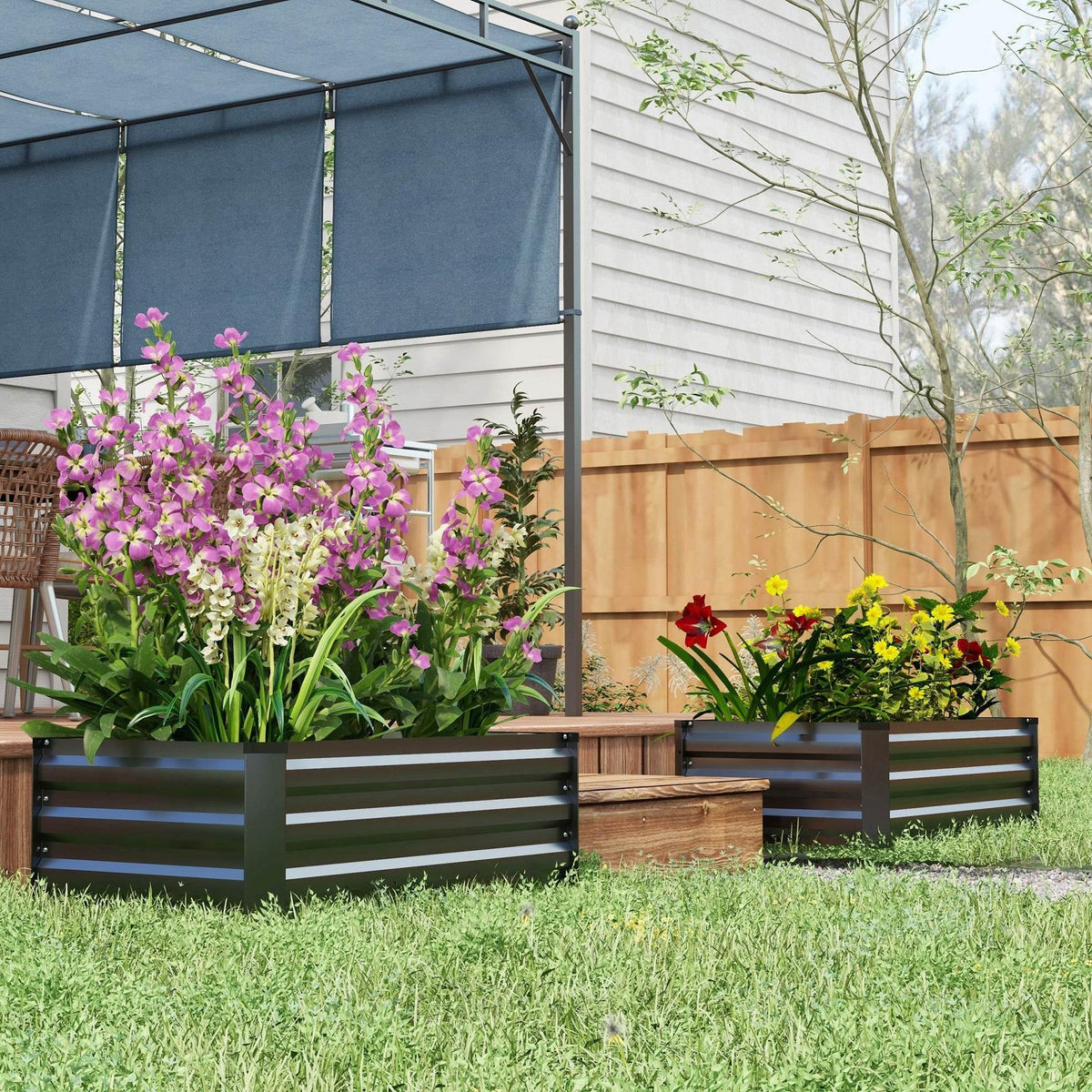 Dark grey elevated garden planters set with flowering plants in slatted beds