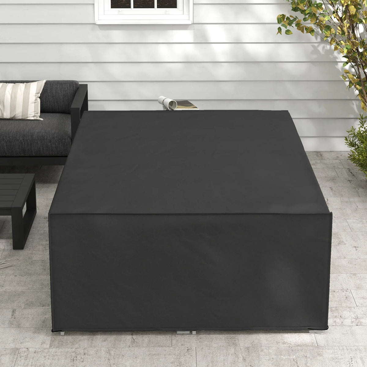 Black outdoor furniture cover with top surface and boxy, form-fitting shape