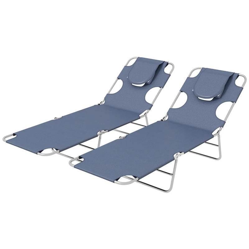 Pair of foldable blue reclining sun loungers with headrest pillows, side view