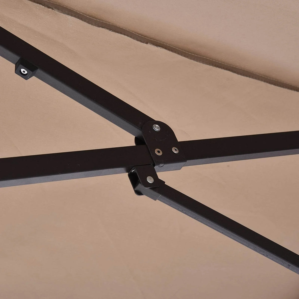 Tan umbrella canopy support arms with black hinge hardware detail