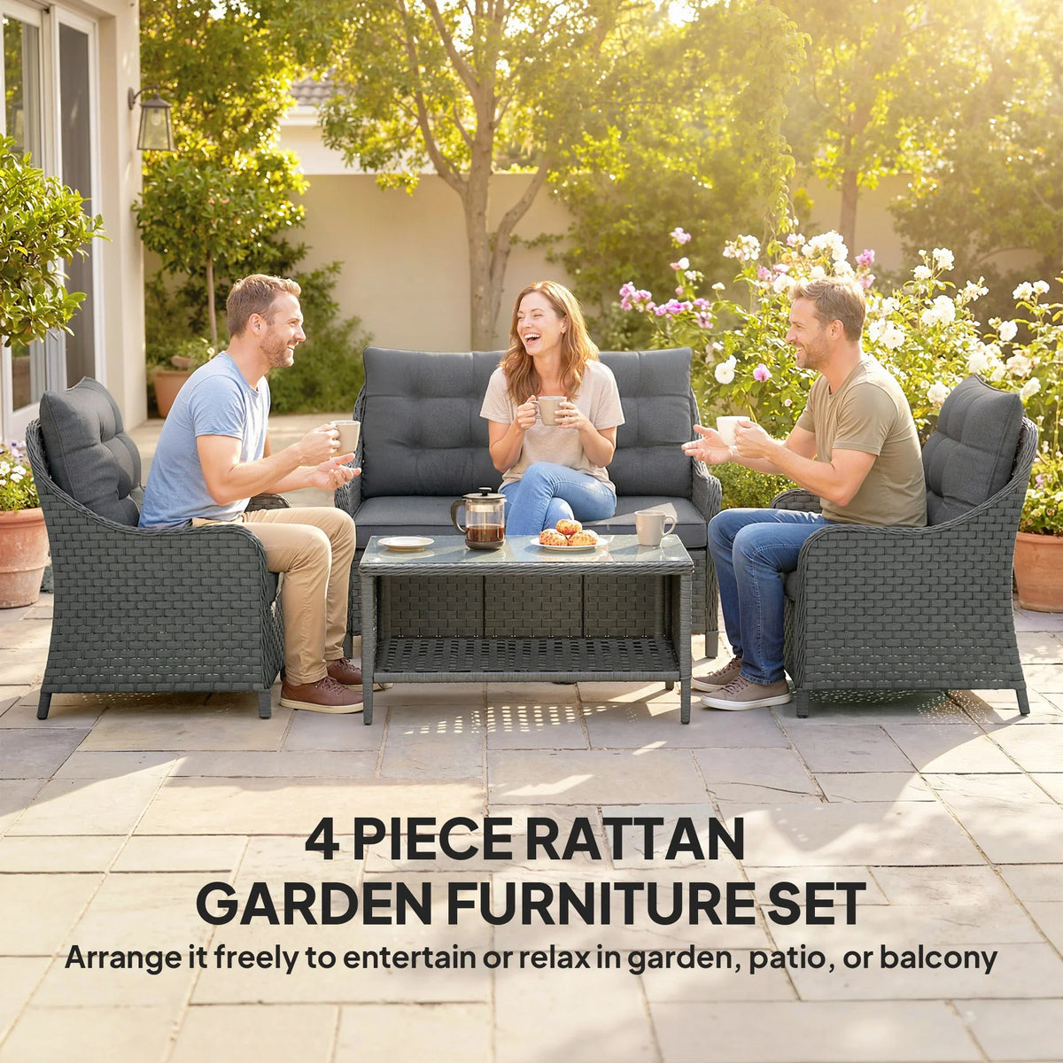Dark grey wicker loveseat with tufted cushions and two armchairs with glass coffee table