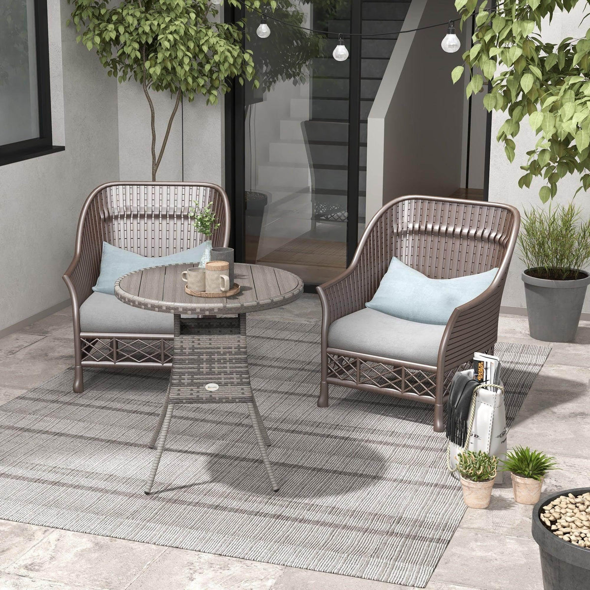 Round grey outdoor dining table with PE rattan weave base and slatted composite top