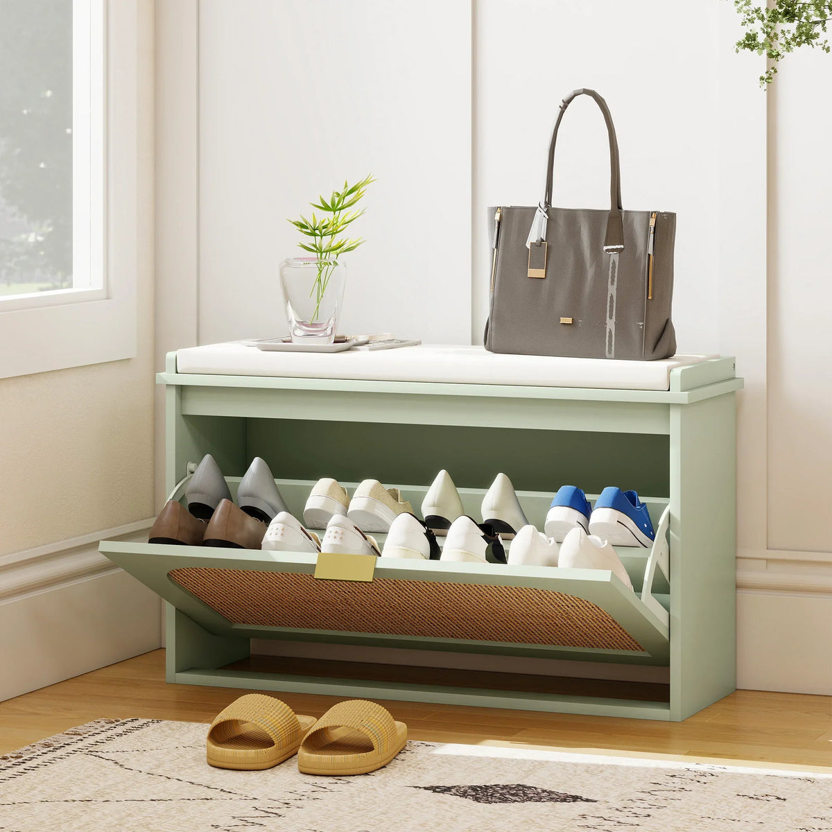 Light green shoe bench with open shelves holding shoes and a smooth top surface.