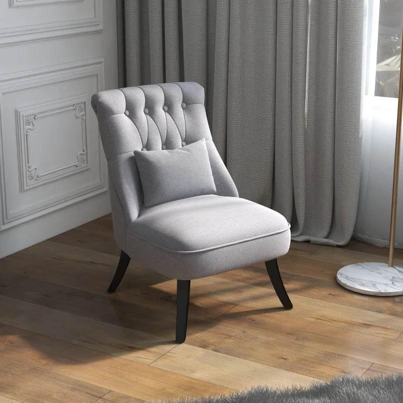Grey upholstered single tub chair with tufted back, arm cushion, and dark wood legs; full view.