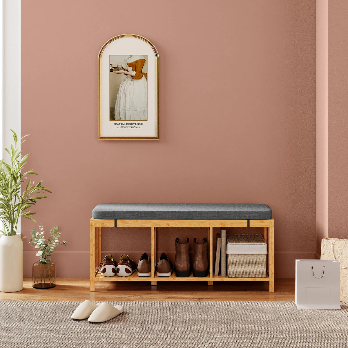 Bamboo shoe bench with dark cushion and open shelving for shoes in entryway