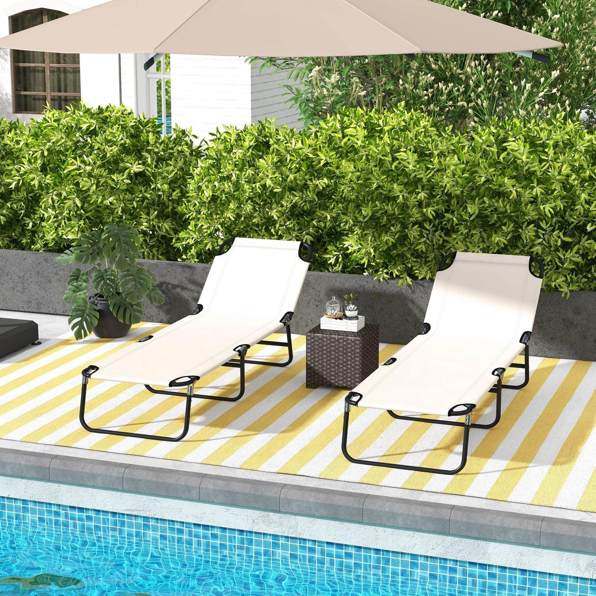 Adjustable cream outdoor sun lounger set with black folding steel frame, two reclined chairs