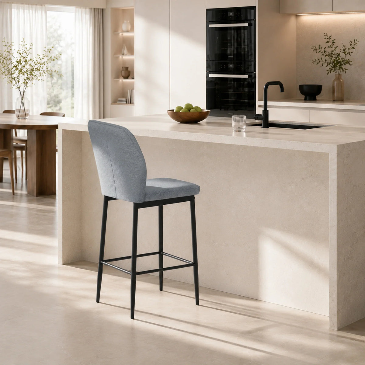 Grey velvet bar stool with backrest and footrest, black metal legs for counters