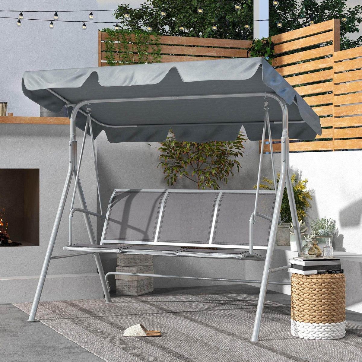 Light gray 3-seat metal garden swing chair with fabric canopy and curved seat/back