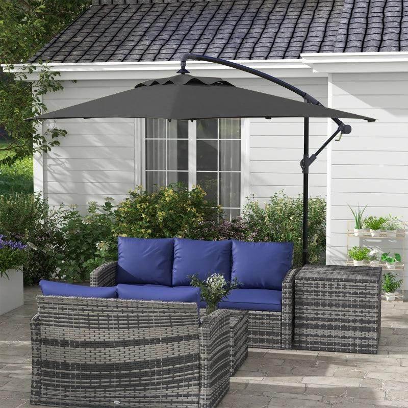 Black cantilever patio parasol with open rectangular canopy over outdoor seating