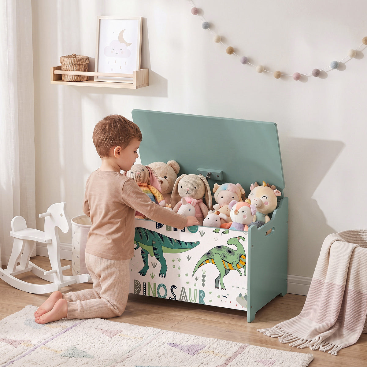 Green wooden toy storage chest with dinosaur print and open lid holding plush toys