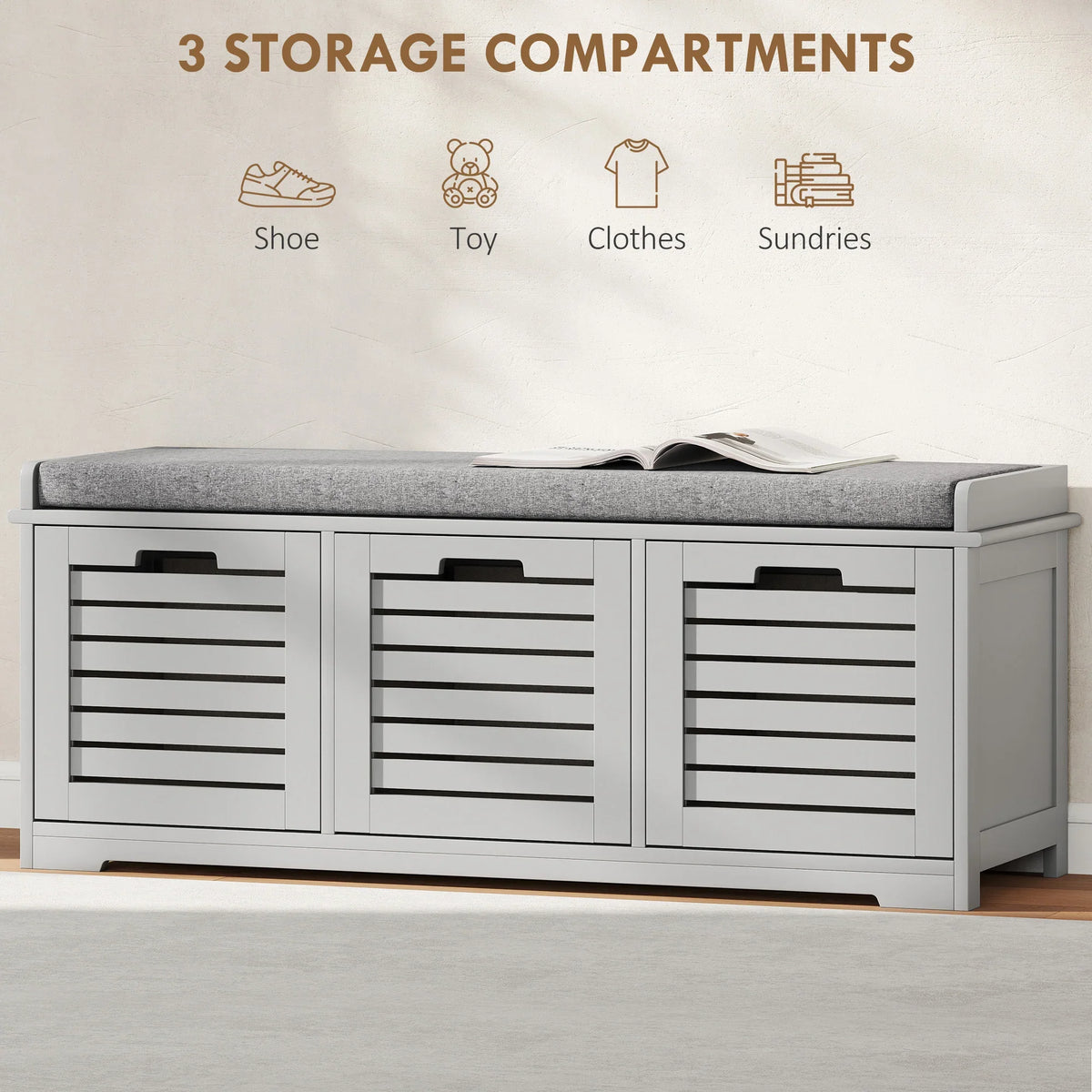 Grey shoe storage bench with cushioned top and three front slatted storage compartments