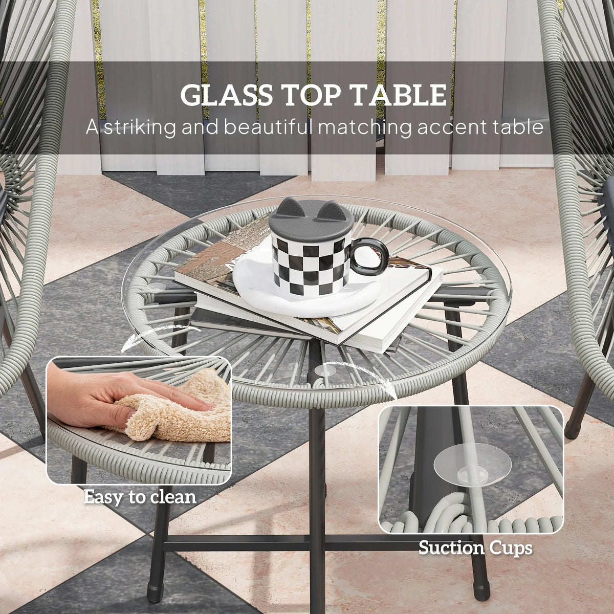 Round glass-top rattan bistro table with a dark metal base and suction feet