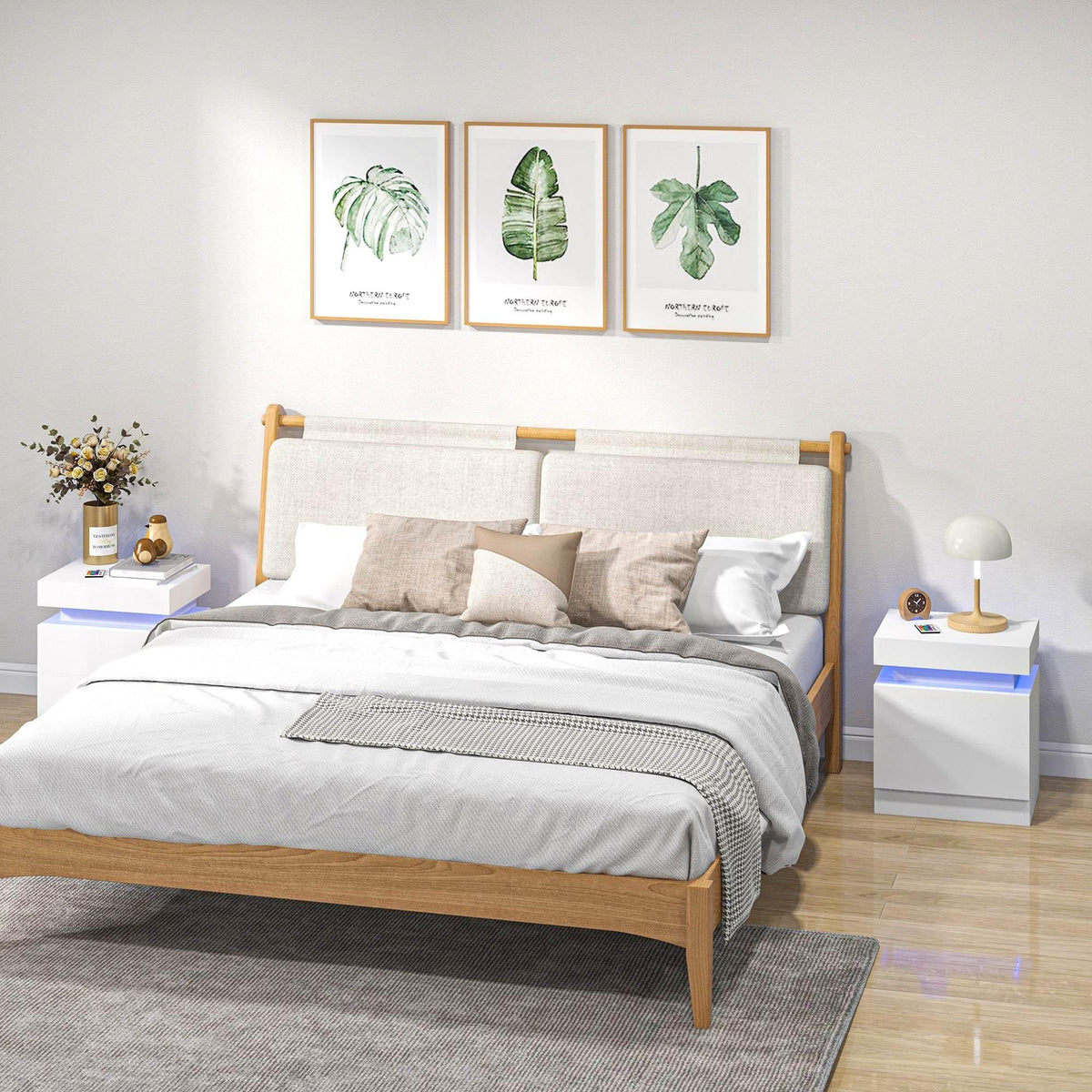 White nightstand with LED accent lighting and drawers next to a bed