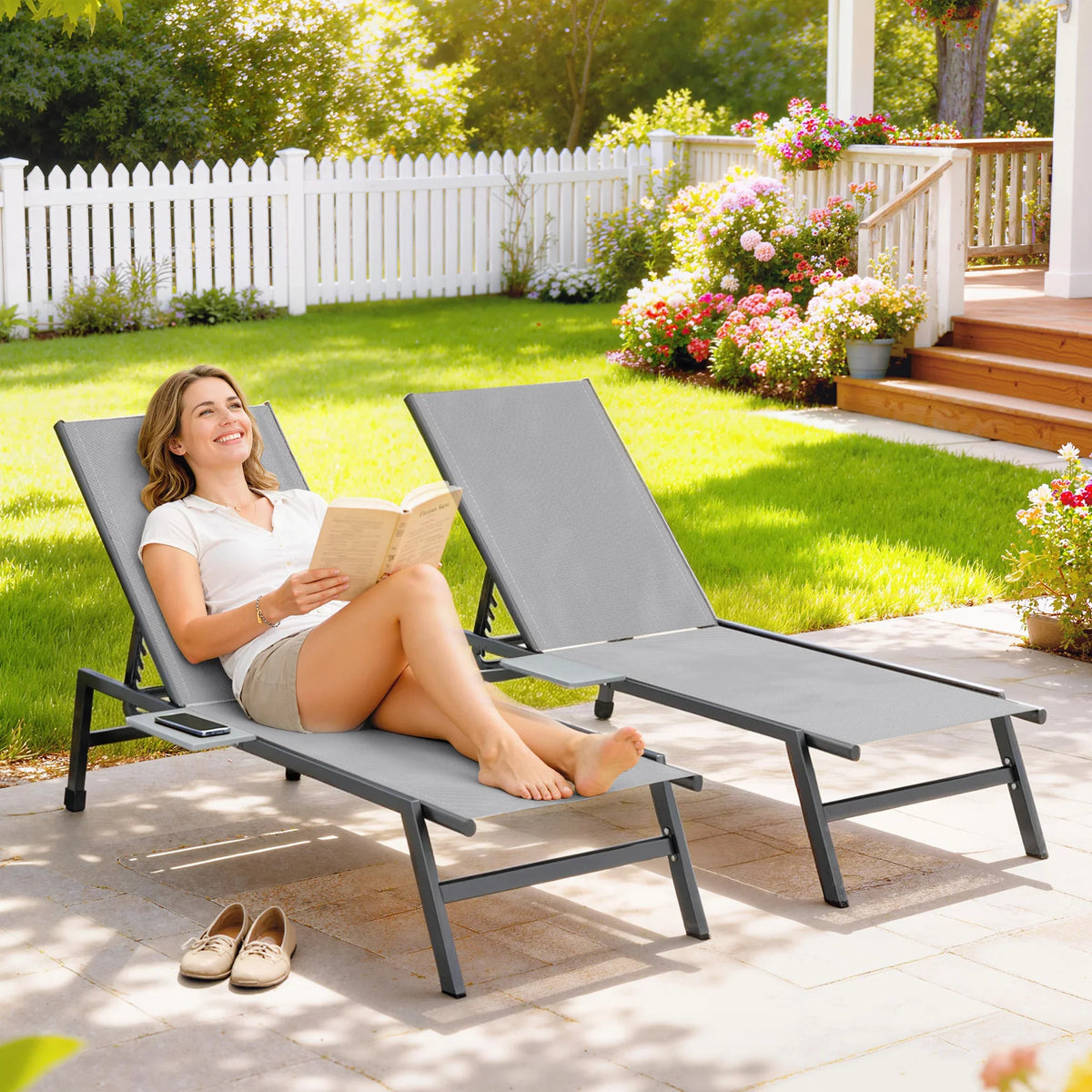 Set of two grey outdoor sun loungers with adjustable reclining backrests
