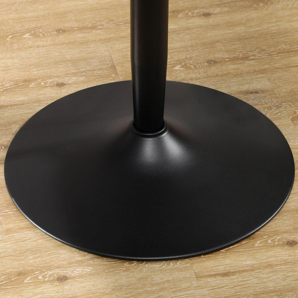 Black circular base plate and pedestal leg for a round dining table