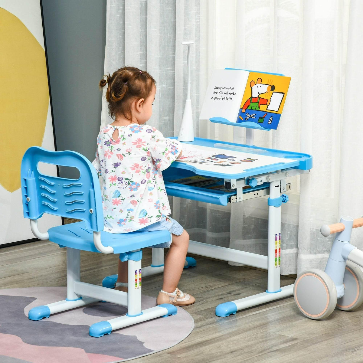 Adjustable kids study desk and chair set in blue with white frame and storage