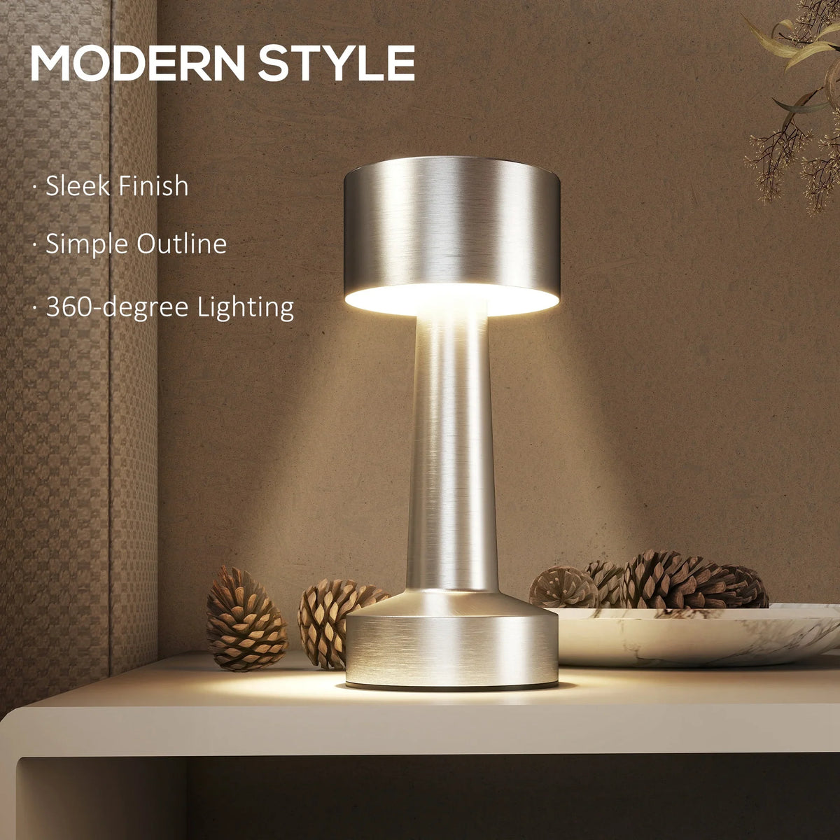 Silver cordless table lamp with drum shade glowing, modern streamlined design