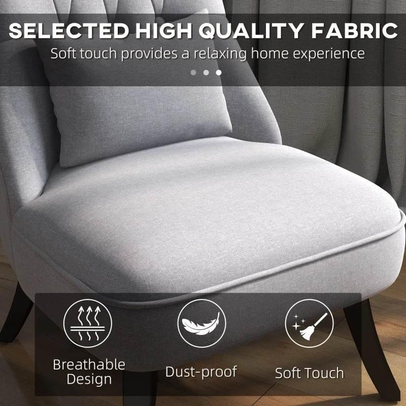 Grey upholstered single tub chair with soft-touch seat and back cushion; close-up view.