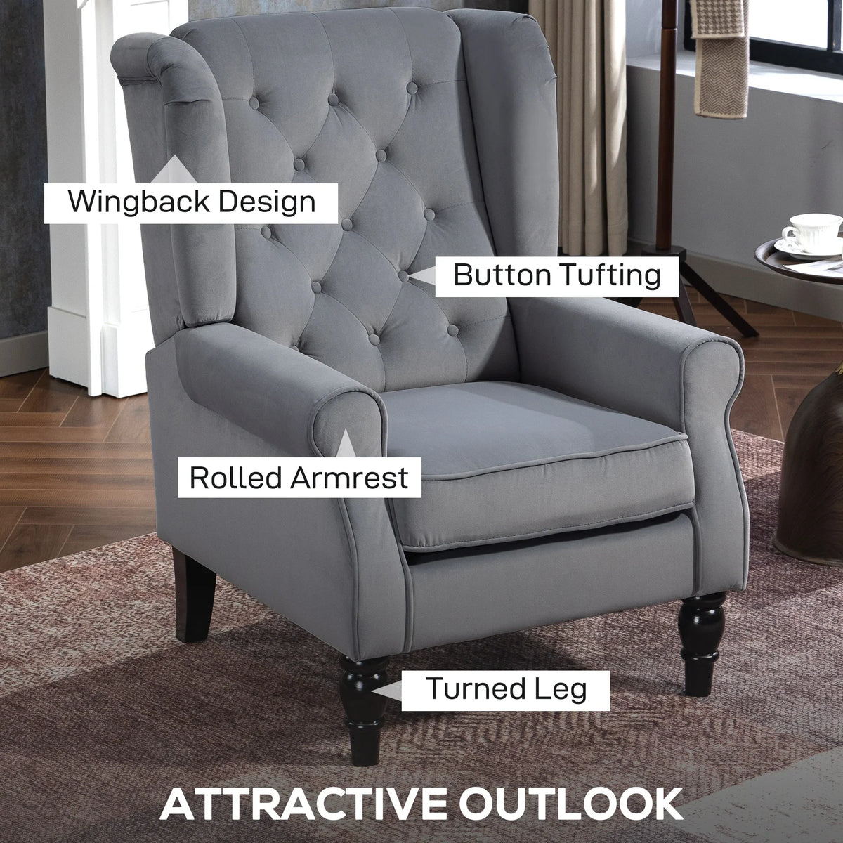 Light gray wingback accent chair with button tufting, rolled arms, and turned legs