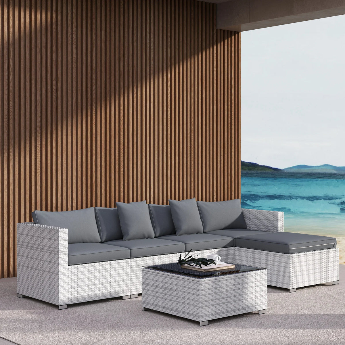 Outdoor corner sofa set with grey cushions, white PE rattan, and square glass-top coffee table
