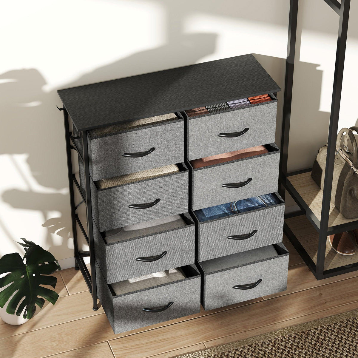 Charcoal grey eight-drawer fabric chest with open compartments and curved pull handles