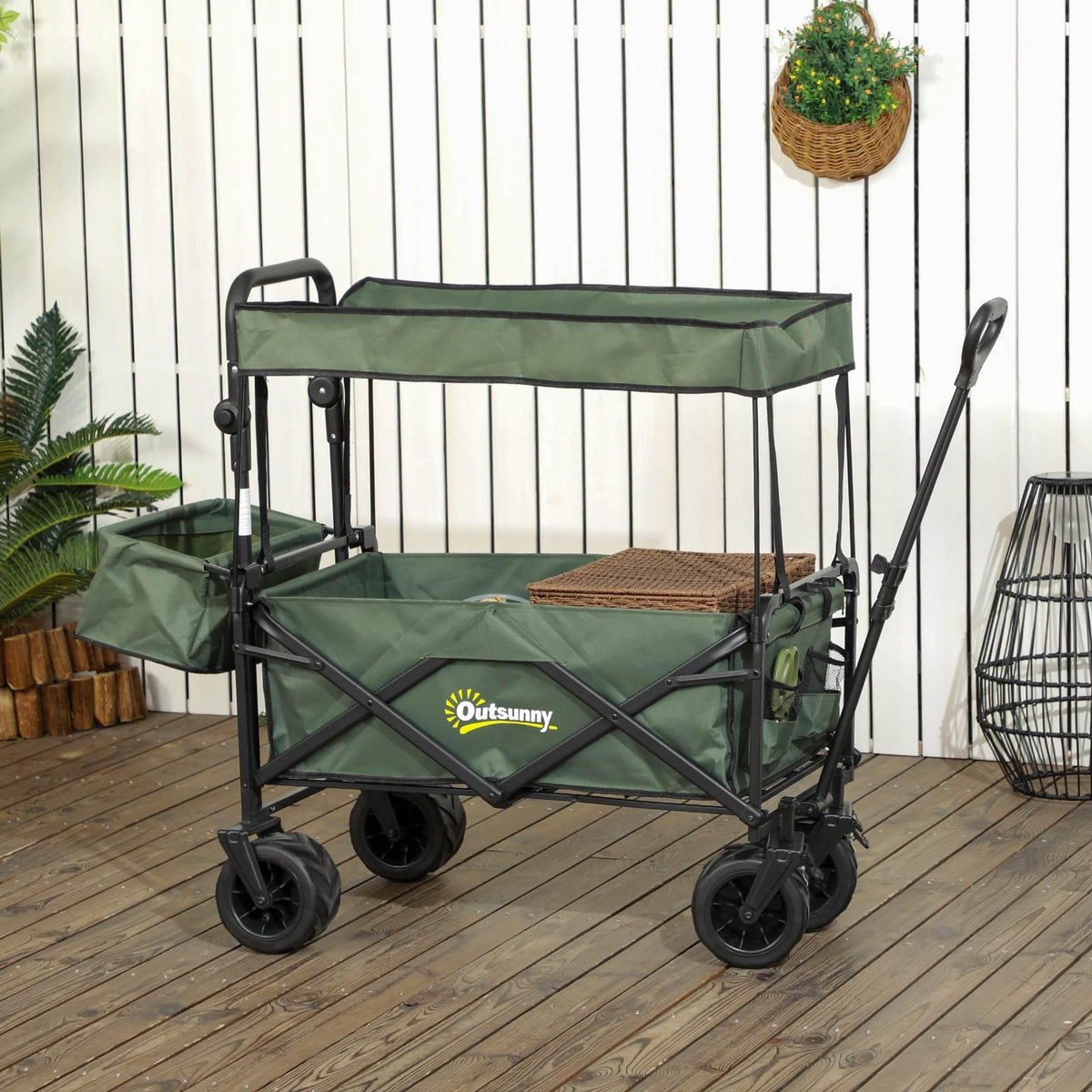 Green folding beach trolley cart with canopy, open storage shelves, and four wheels