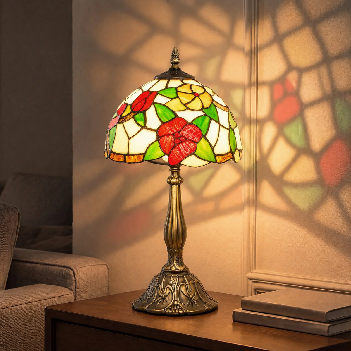 Red and green stained glass table lamp with floral shade and brass pedestal base