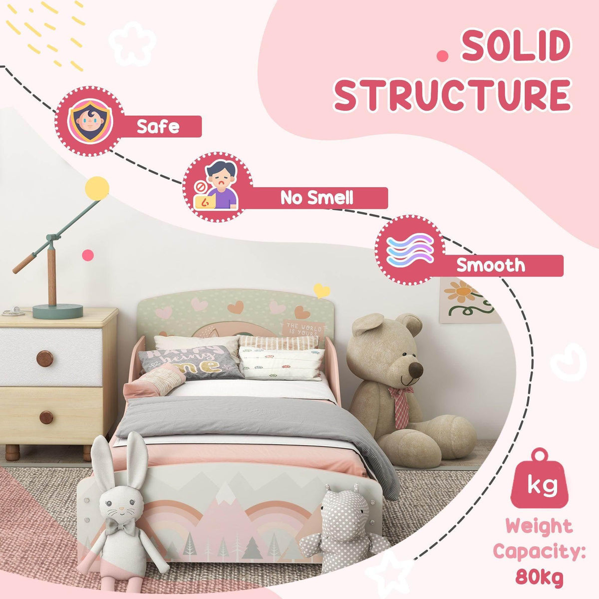 Pink toddler bed frame with rainbow and mountain print, plush stuffed animals on floor