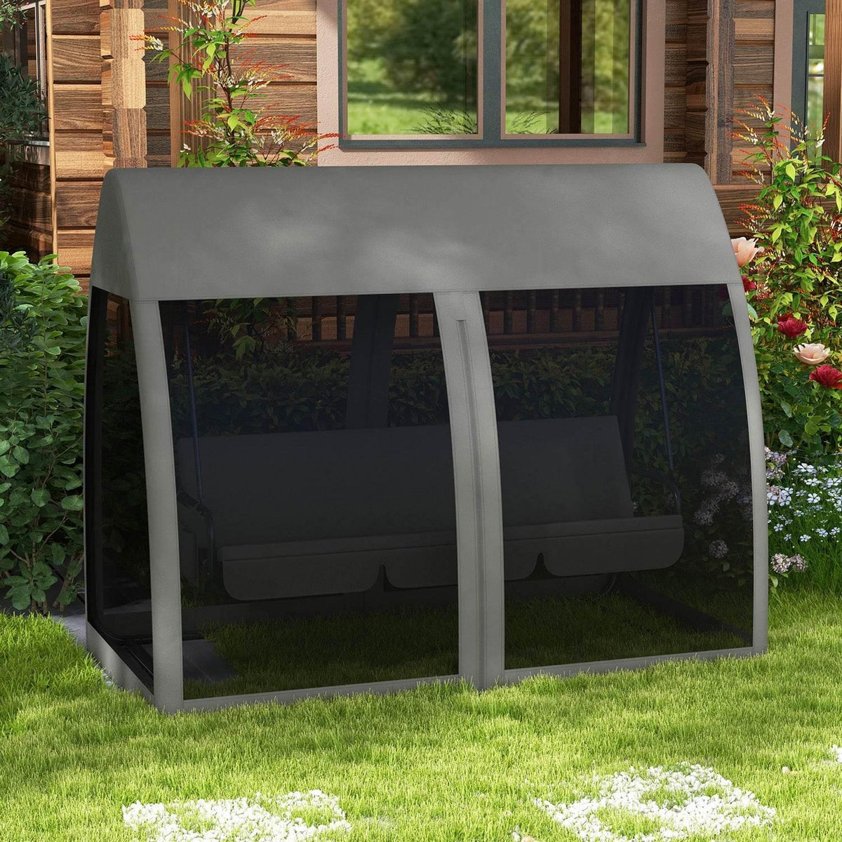 Grey outdoor swing chair bed with full mosquito-net panels under roof canopy