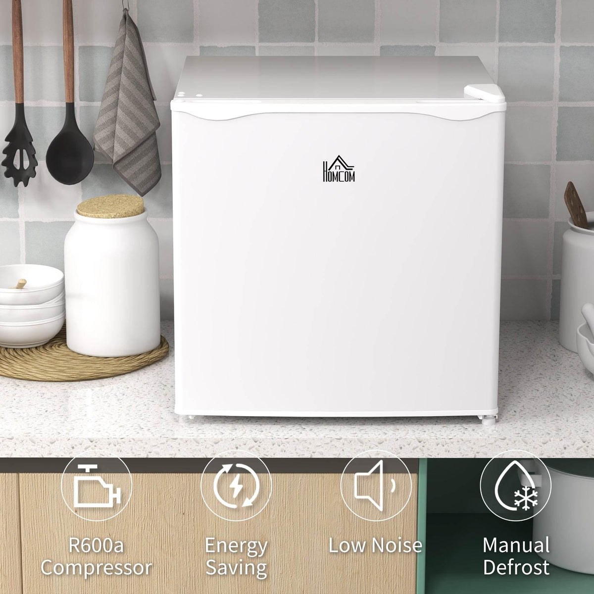 White mini freezer on countertop with front logo and curved lid handle.