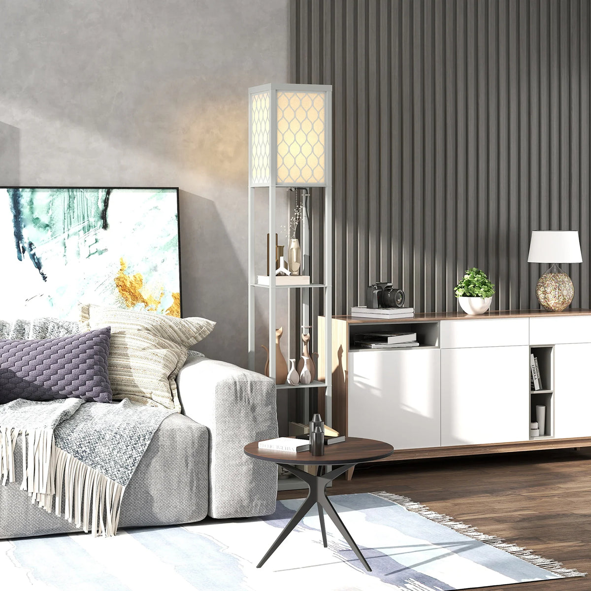 Gray-and-white three-shelf standing lamp with honeycomb shade next to sofa