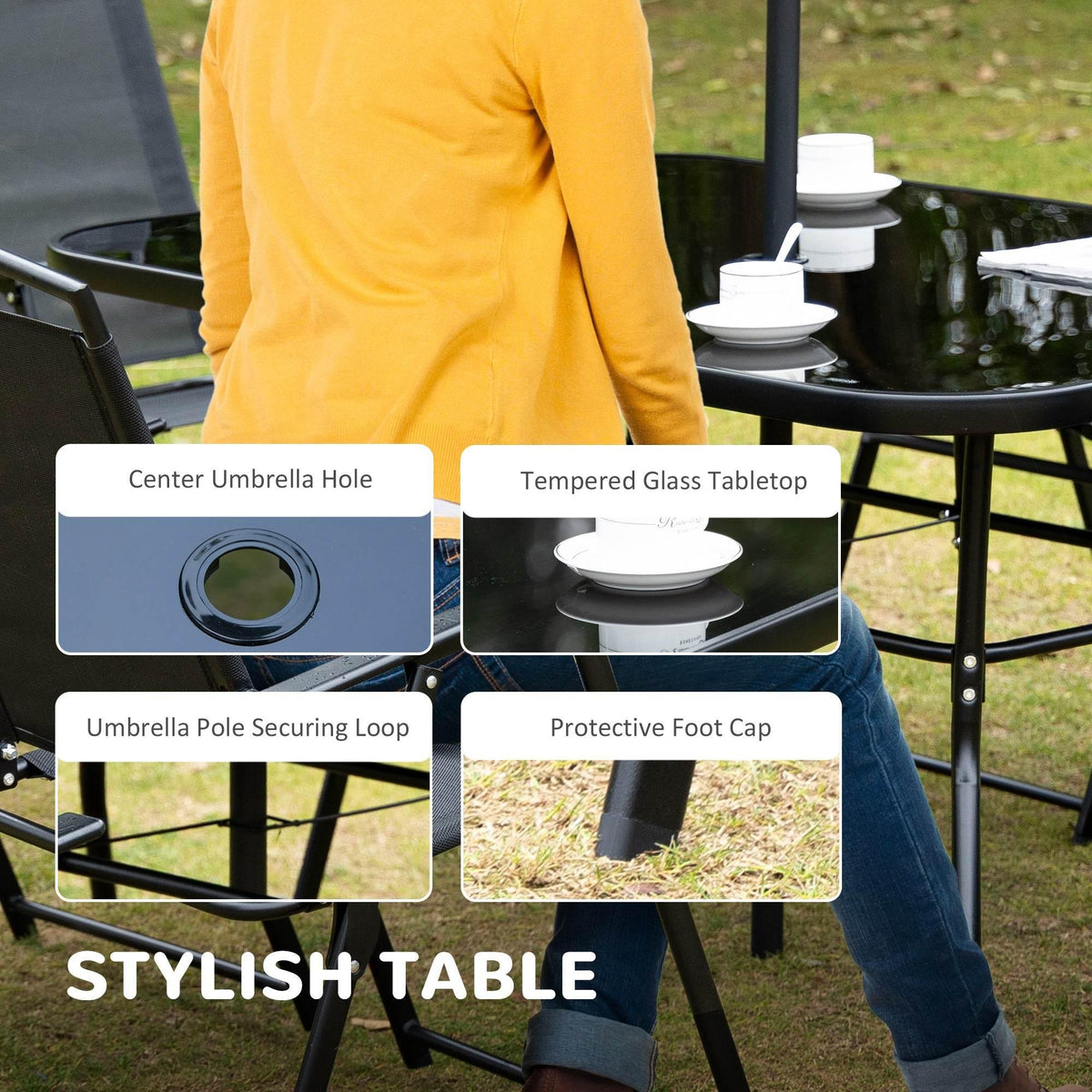 Black patio table with tempered glass top and center umbrella hole, with folding chairs