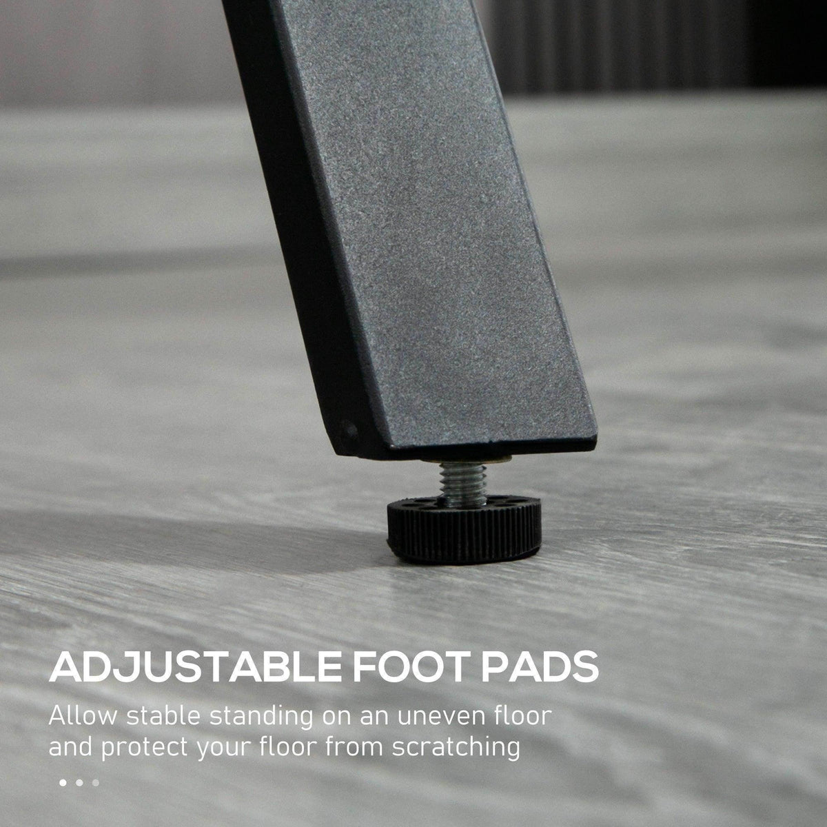Adjustable leveling foot with rubber pad on black steel bar table leg