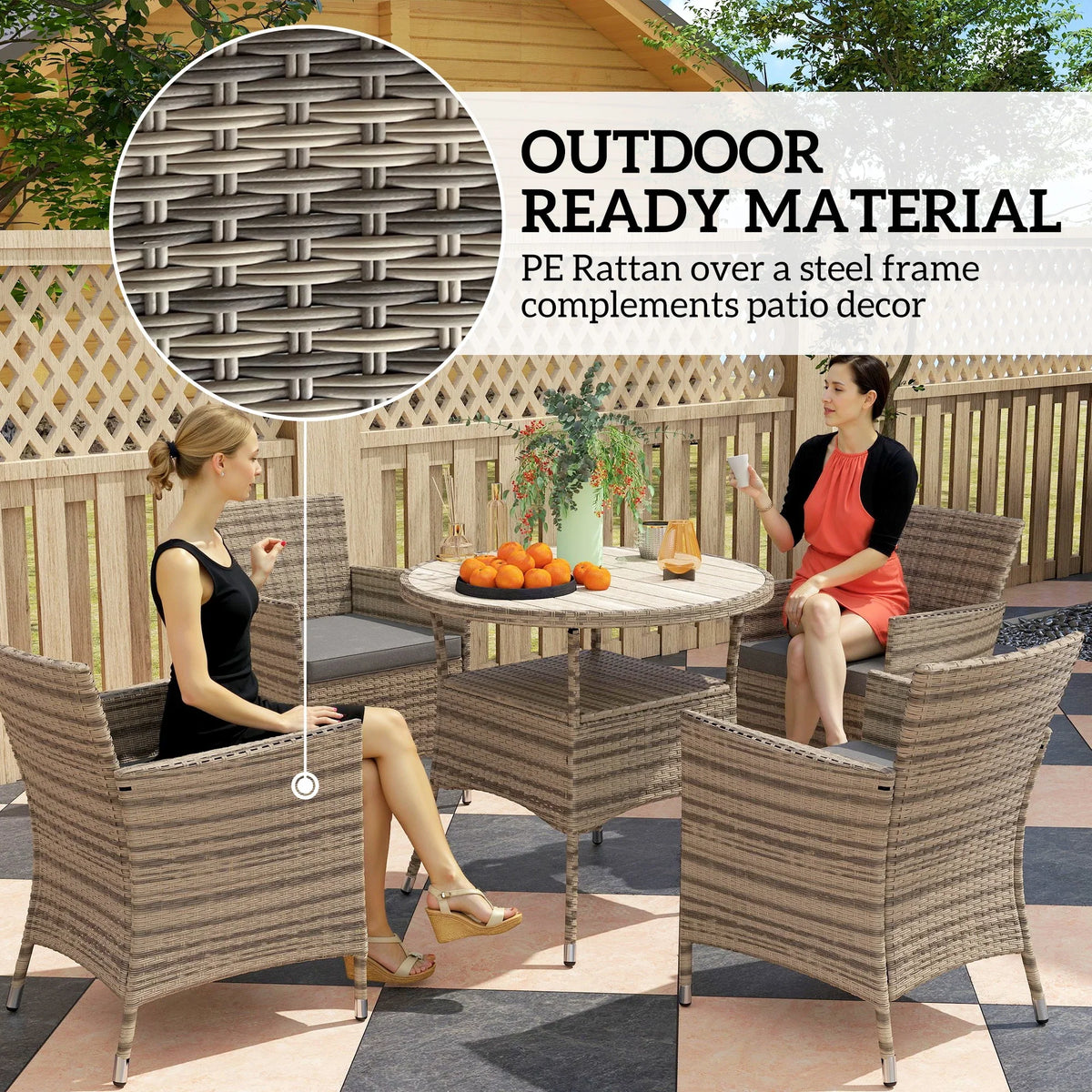 Grey rattan patio set corner view with four armchairs and round two-tier table