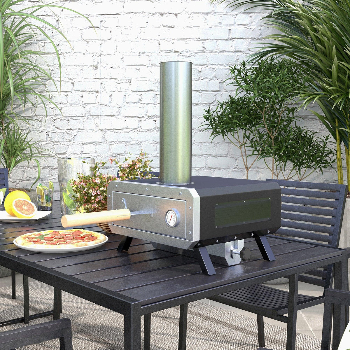 Portable wood-fired pizza oven on outdoor table with chimney, vent, and front door