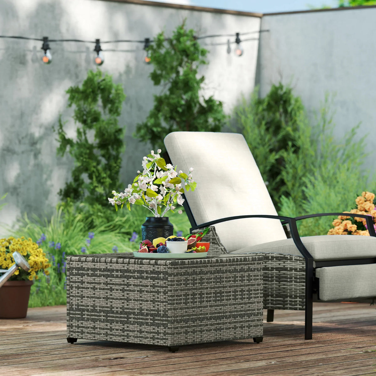 Grey woven rattan garden side table with clear tempered glass top and black frame